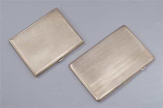 Two engine turned silver cigarette cases, largest 12.8cm.